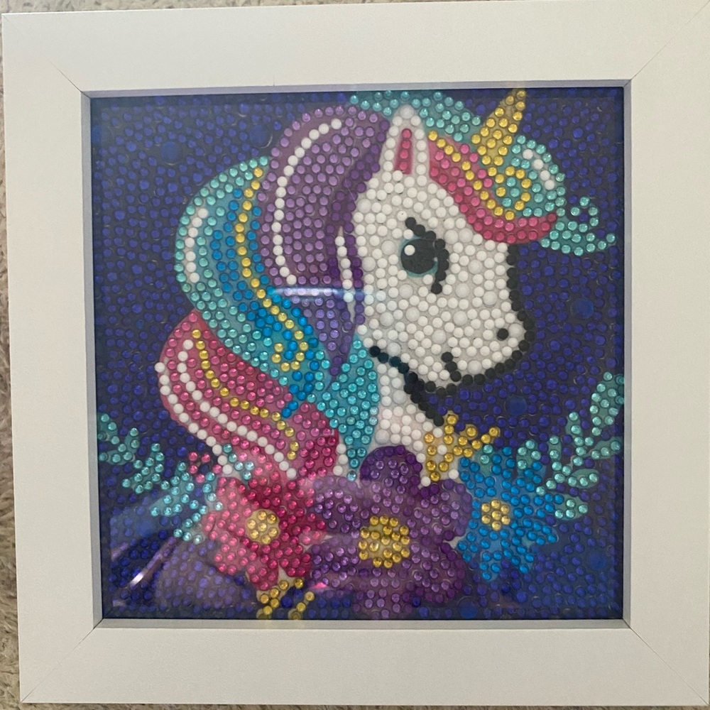 Framed finished Unicorn diamond art.